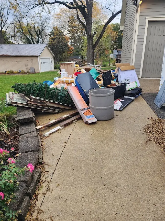 Dumpster being loaded with debris for Residential Dumpster Rental in Suffield